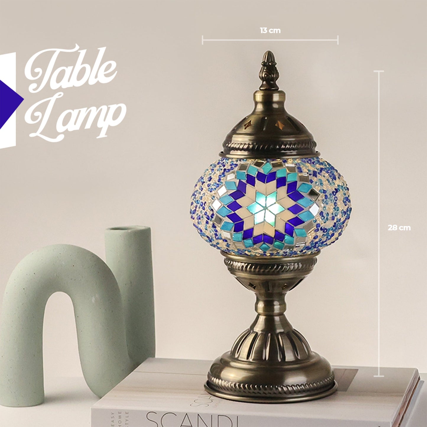 Decorative table lamp with mosaic design on a neutral background
