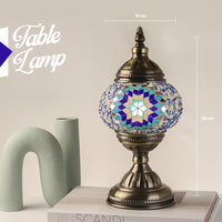 Decorative table lamp with mosaic design on a neutral background